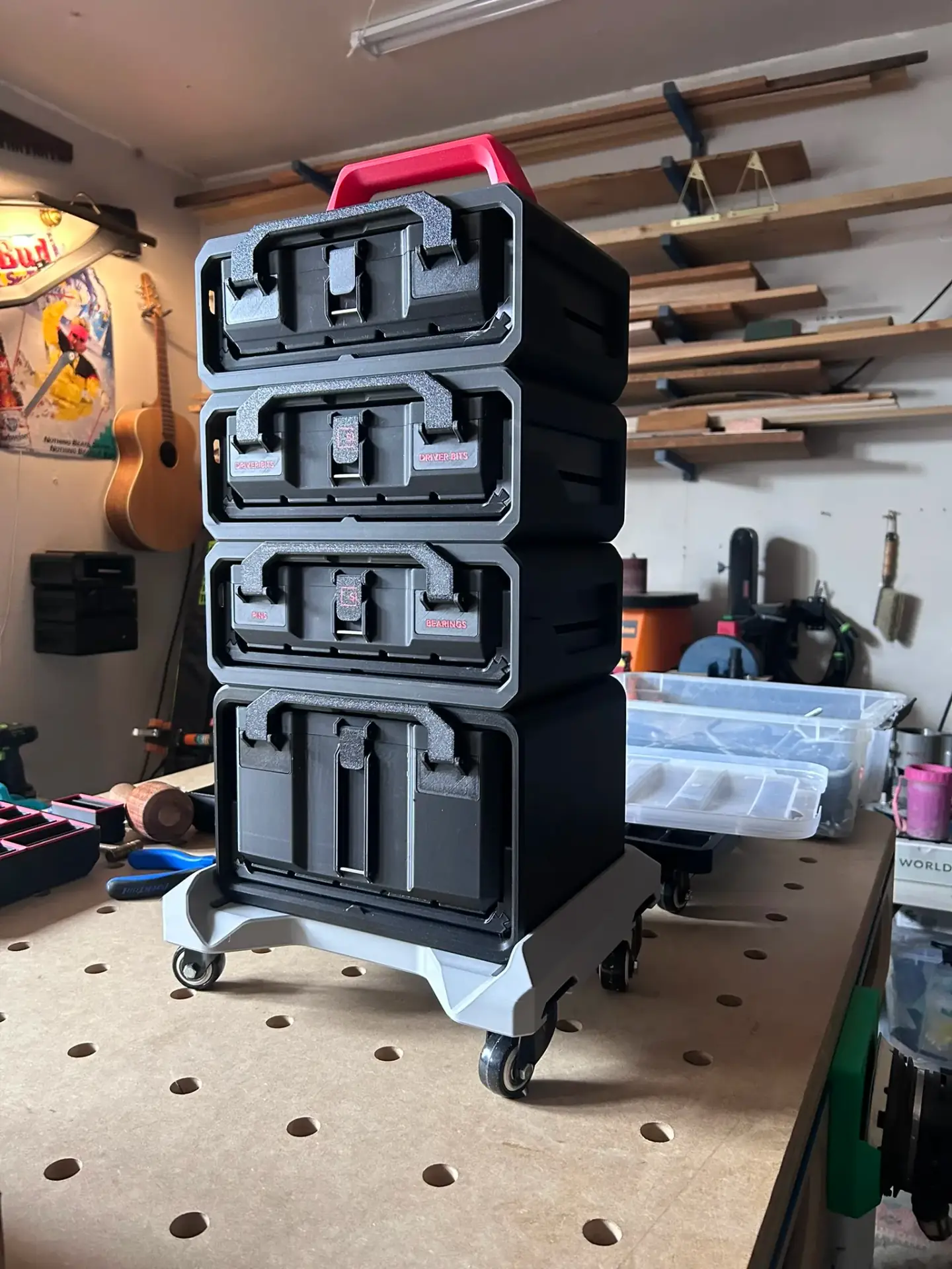 Graphite Modular Gridfinity-compatible storage boxes arranged in an organised workshop setup